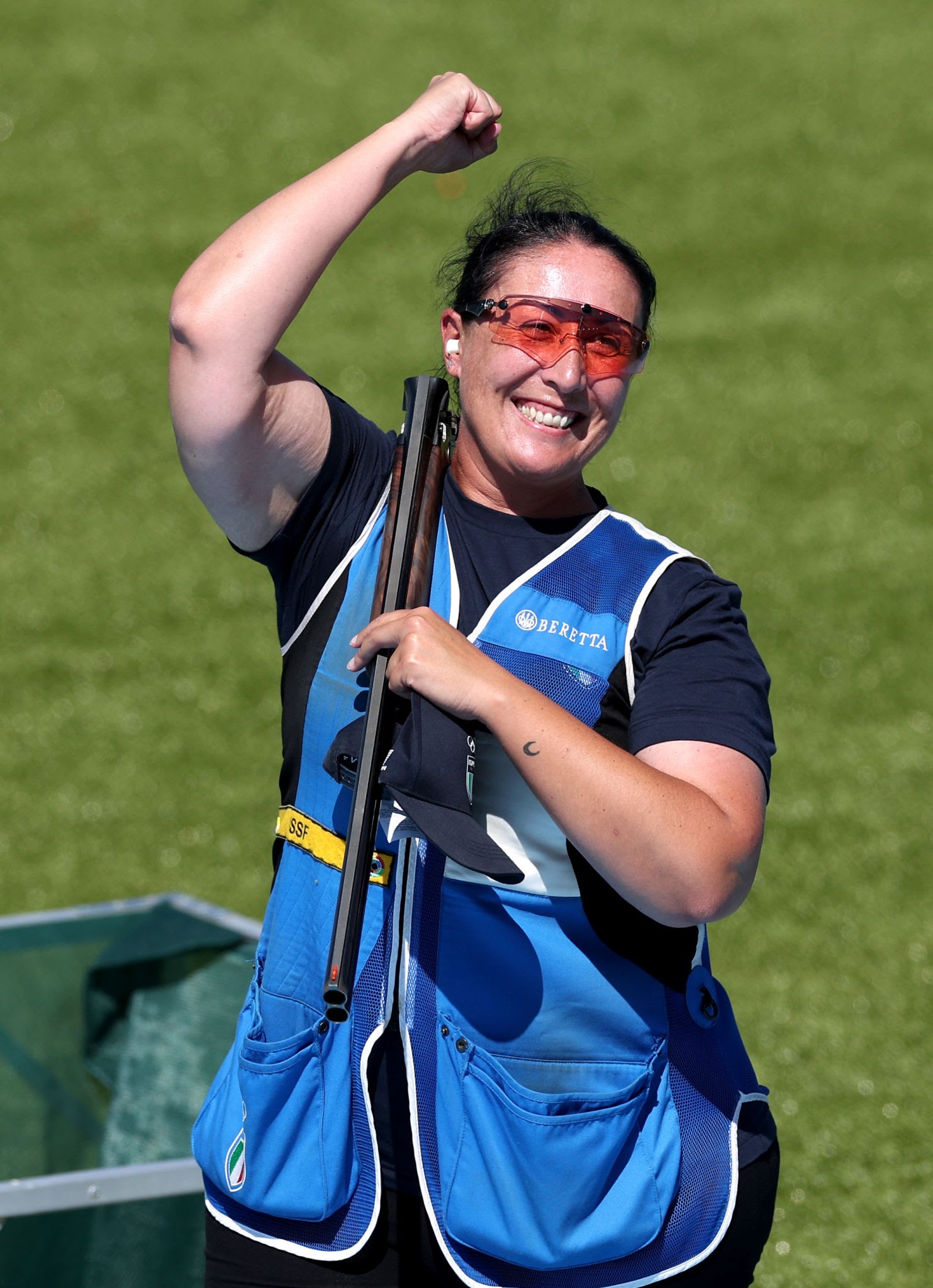 CHATEAUROUX, FRANCE - AUGUST 05: Diana Bacosi of Team Italy reacts after the Skeet Mixed Team Gold Medal Match between Team Italy and Team United States on day ten of the Olympic Games Paris 2024 at Chateauroux Shooting Centre on August 05, 2024 in Chateauroux, France. (Photo by Charles McQuillan/Getty Images)